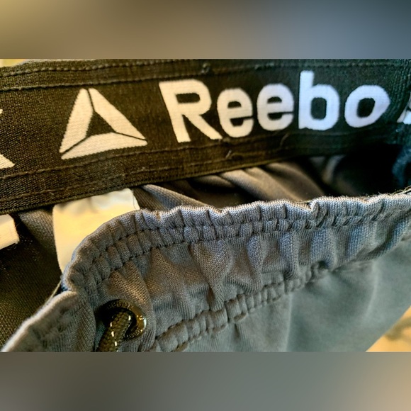 Reebok Dark Gray Stretchy Soft Track Pants. 3 pockets.  Zippers at leg base. - Picture 13 of 13